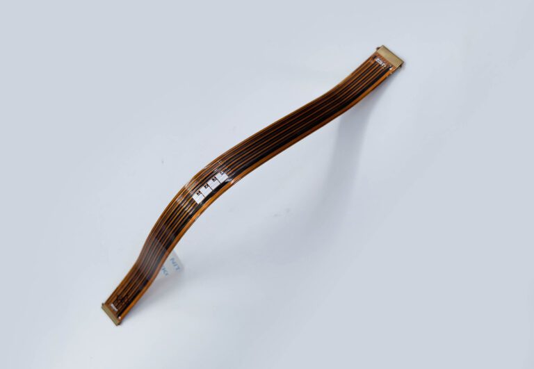 Elastic-style flexible circuit used in joint motion feedback, illustrating stretchable electronics concepts for wearables and medical devices